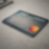 A close-up view of a debit card on a modern financial desk